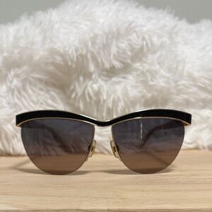 SWAROVSKI: Elegant Black and Gold Sunglasses